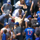 Illustration for article titled Cubs Fan Jumps For Home Run Ball, Misses It, Removes Shirt, Curses Sky Gods